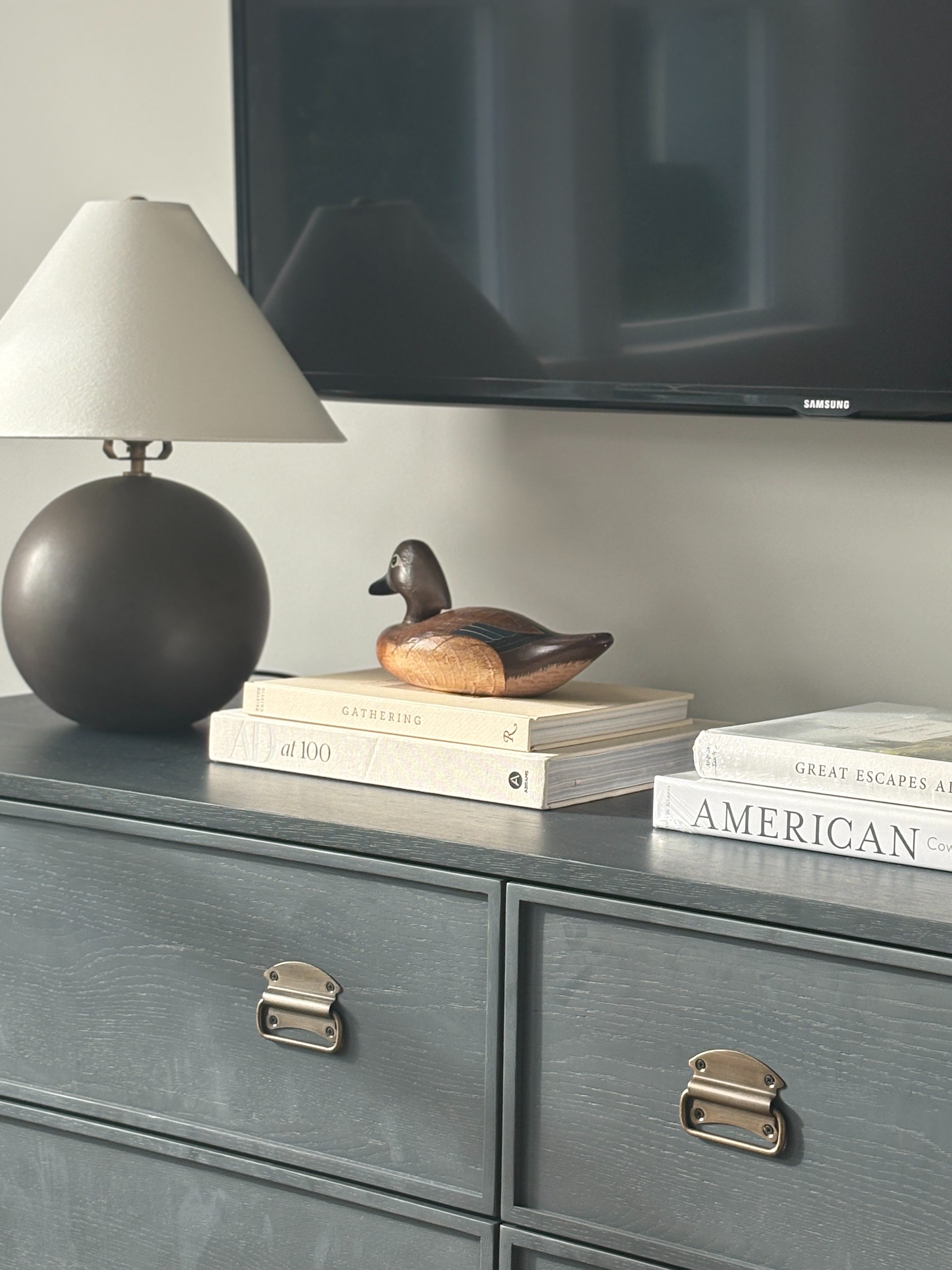 ✨ How to style a dresser in your bedroom so it feels polished but effortless. I love keeping it simple — a sculptural lamp for height, a few stacked coffee-table books for balance, and a small decorative accent (like this vintage duck) for personality. 🕯️

This mix adds warmth and texture without cluttering the space — perfect for a cozy, curated look that still feels lived-in. Shop my favorite lamps, books, and decor accents to recreate the look. 🤍

#BedroomStyling #DresserDecor #LTKhome #NeutralHomeDecor #OrganicModern #InteriorStyling #HomeInspo #LTKstyletip #MinimalDecor #DesignDetails 

 #LTKHome