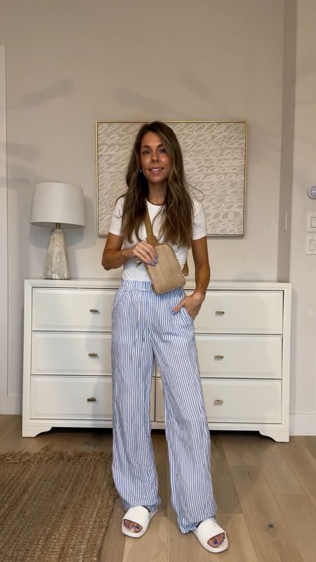 Travel outfit! Trending blue and white striped drawstring pants H&M and the best double lined seamless tee for $10!! 

#LTKFindsUnder100 #LTKFindsUnder50 #LTKTravel