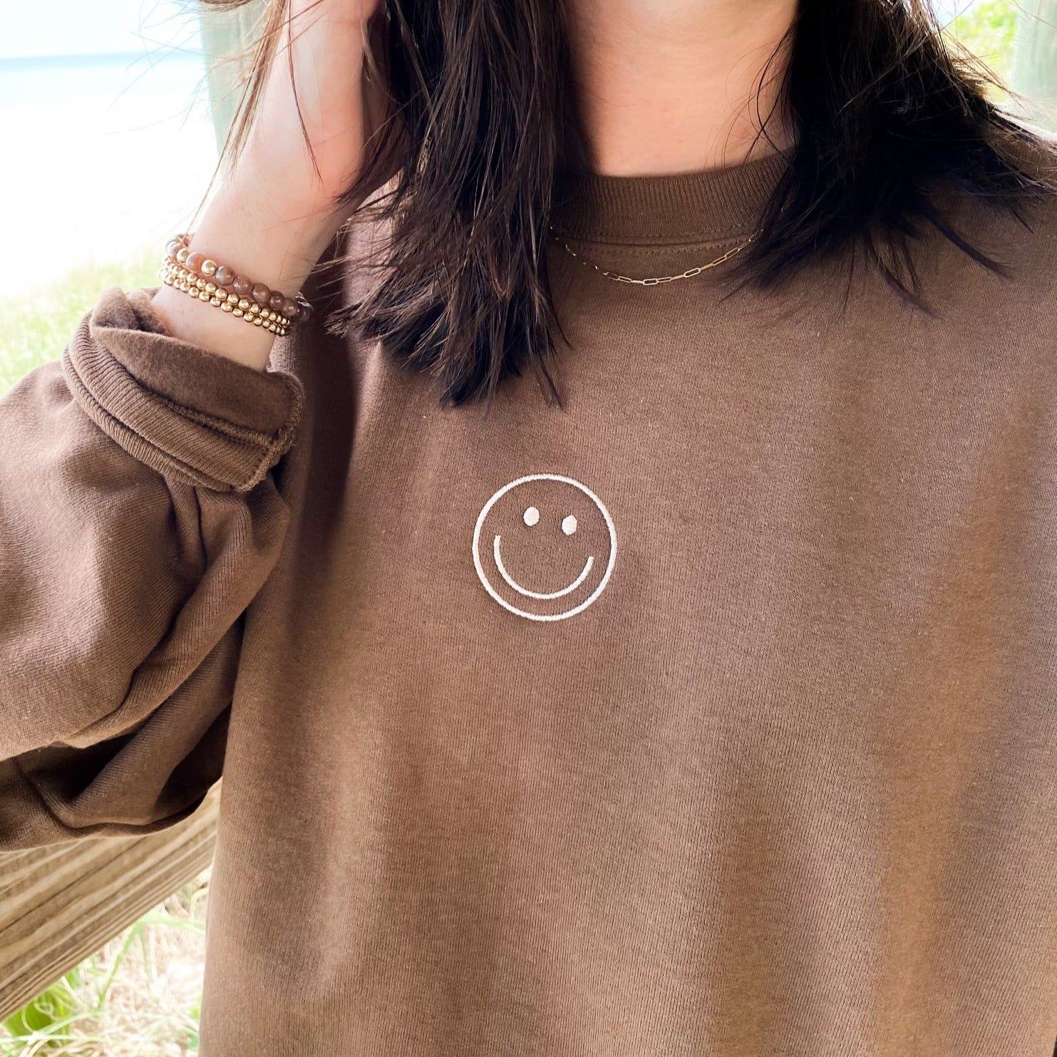 smiley face sweatshirt | brown | Reef rain aria