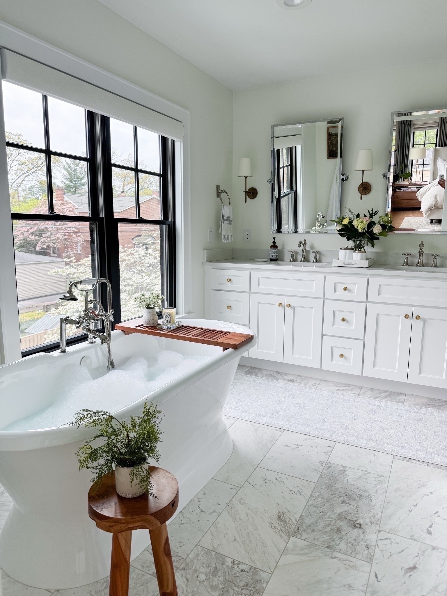 This primary bath is all about elevated ease—marble finishes, a deep soaking tub, warm brass accents, and a washable runner that softens the space without the stress. I mixed metals throughout to keep it feeling collected, not too matchy. Linked the exact sconces, rug, and a few timeless bathroom details you can layer into your own home. #LTKhome #bathroomdesign #primarybathroom #modernclassic #marblebathroom #brassfixtures #spaathome 

#LTKHome #LTKFindsUnder50 #LTKFindsUnder100