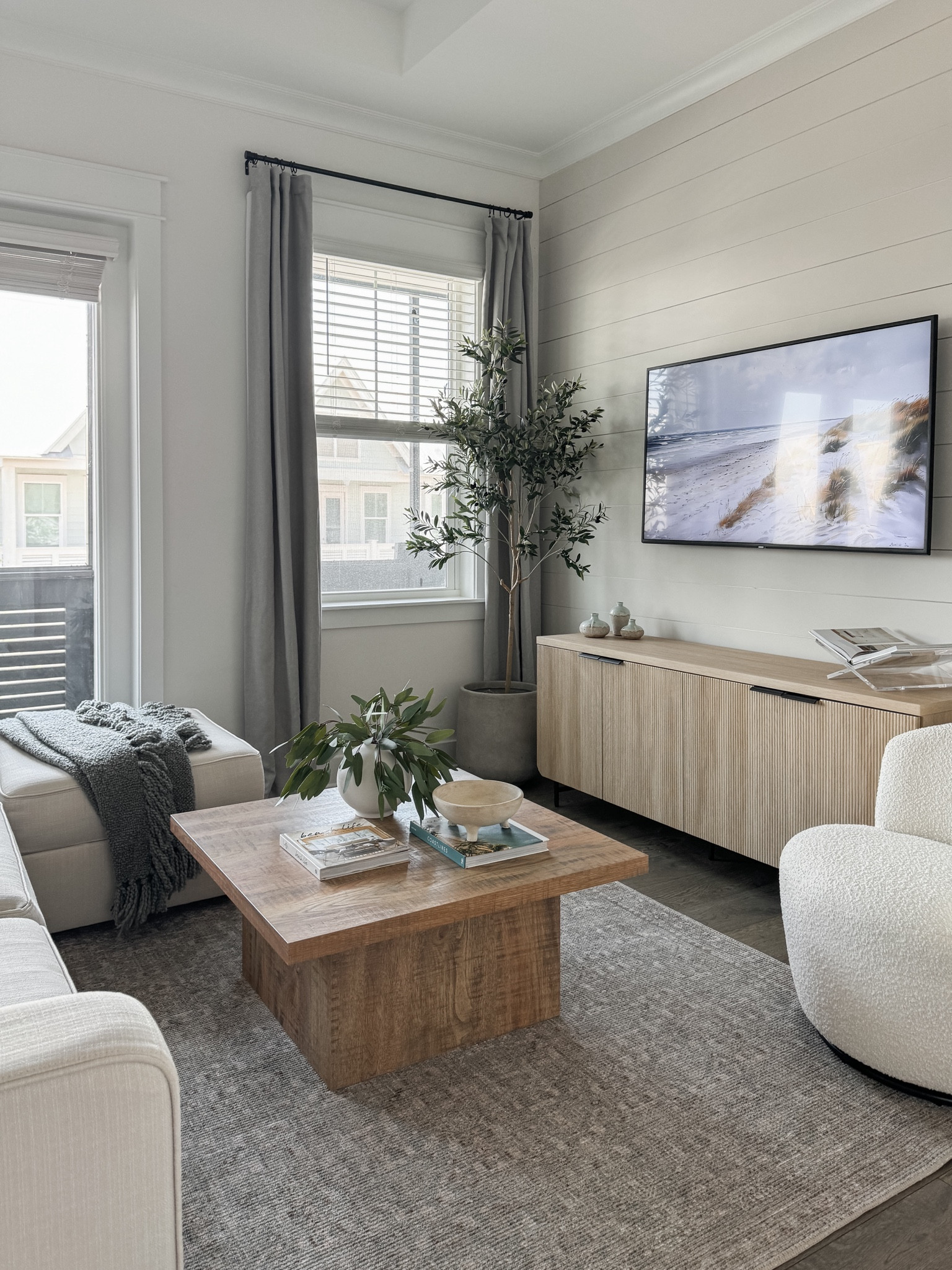 Our living room in our beach home. I love this rug so much! It’s such a great price and I’ve been dying to use this color/pattern in our own home! The colors are still earthy and neutral but keep the space light/offers contrast! 

#LTKHome #LTKStyleTip #LTKSaleAlert