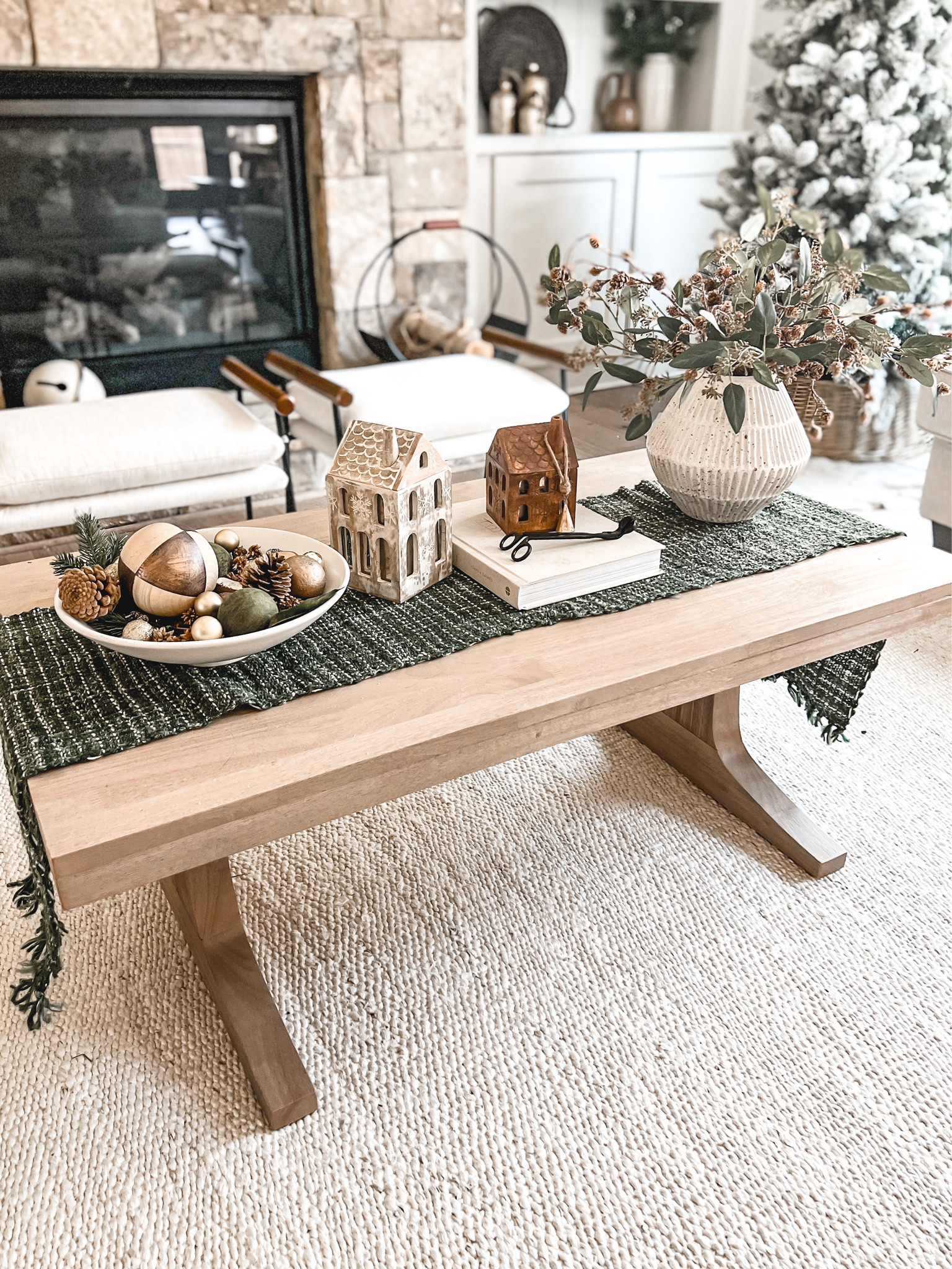 I’m slowly transforming my home into a winter wonderland! I’ve decided to go with dark green, gold, with touches of black. I wanted to create a sort of gilded woodsy look for this year! ✨🌲👌🏼This is how I’ve styled my coffee table for holidays! 

Coffee table, holiday decor, ornaments, candles, candle houses 

#LTKSeasonal #LTKhome #LTKHoliday