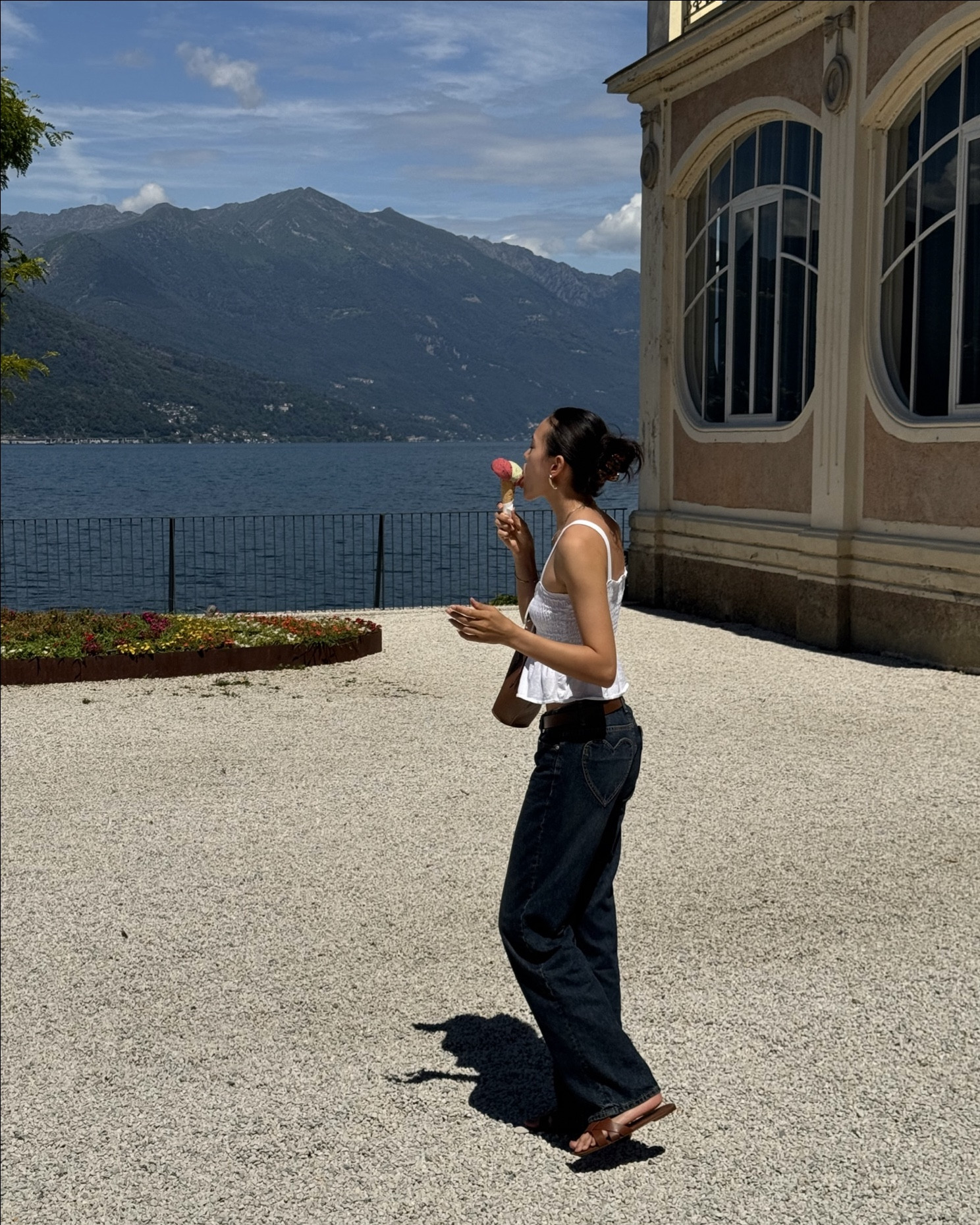 italy summer vacation outfit 💗 white babydoll top, heart pocket blue jeans, brown bag and gelato date 🍦

#LTKsummer #LTKeurope #LTKtravel