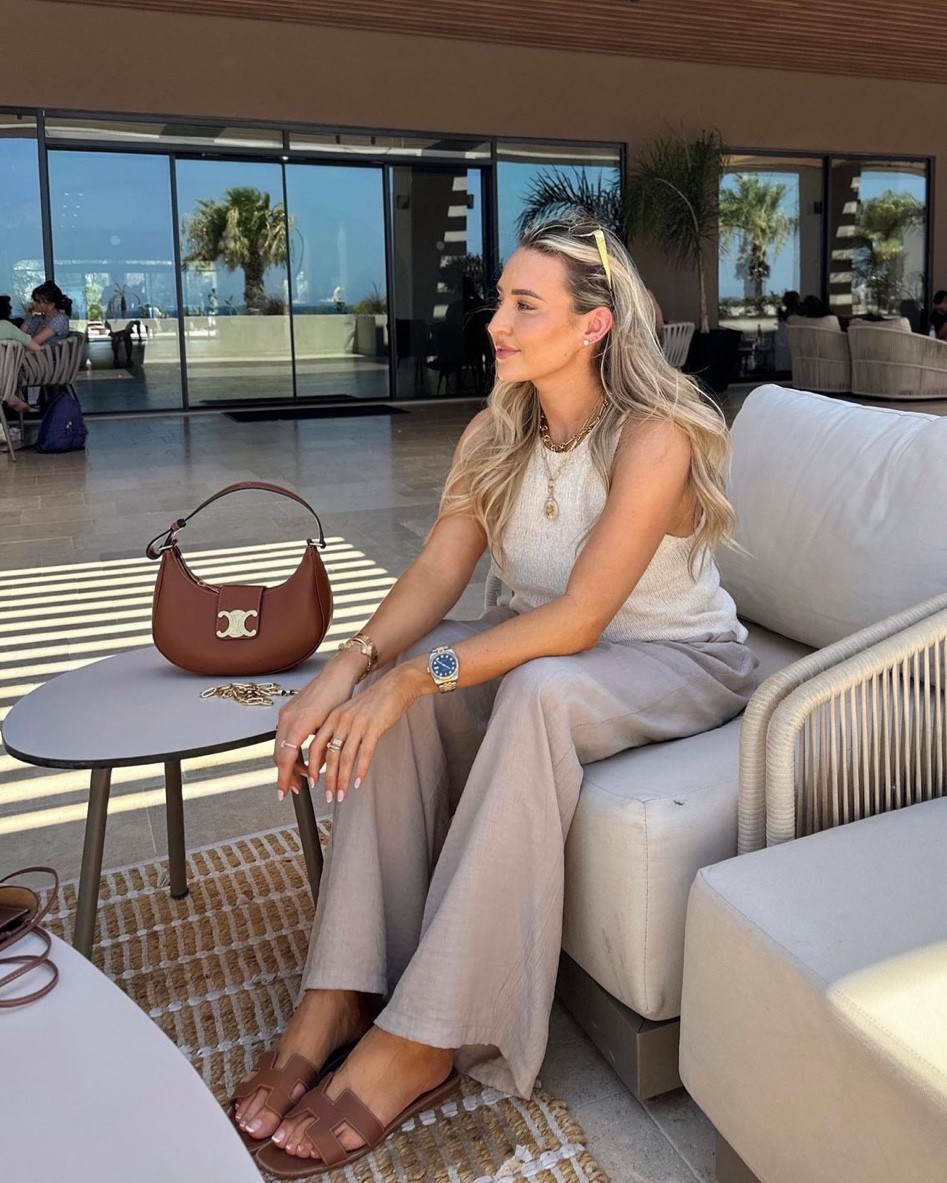 Chic holiday outfit - Massimo Dutti top & trousers, Céline Ava handbag, Céline metal triomphe sunglasses, Hermès oran tan sandals (dupe linked)

#LTKshoecrush #LTKitbag #LTKeurope