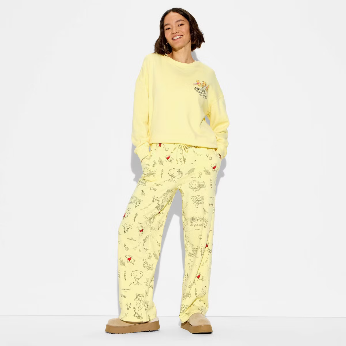 Women's Winnie The Pooh Fleece Graphic Sweatpants - Honey Yellow | Target