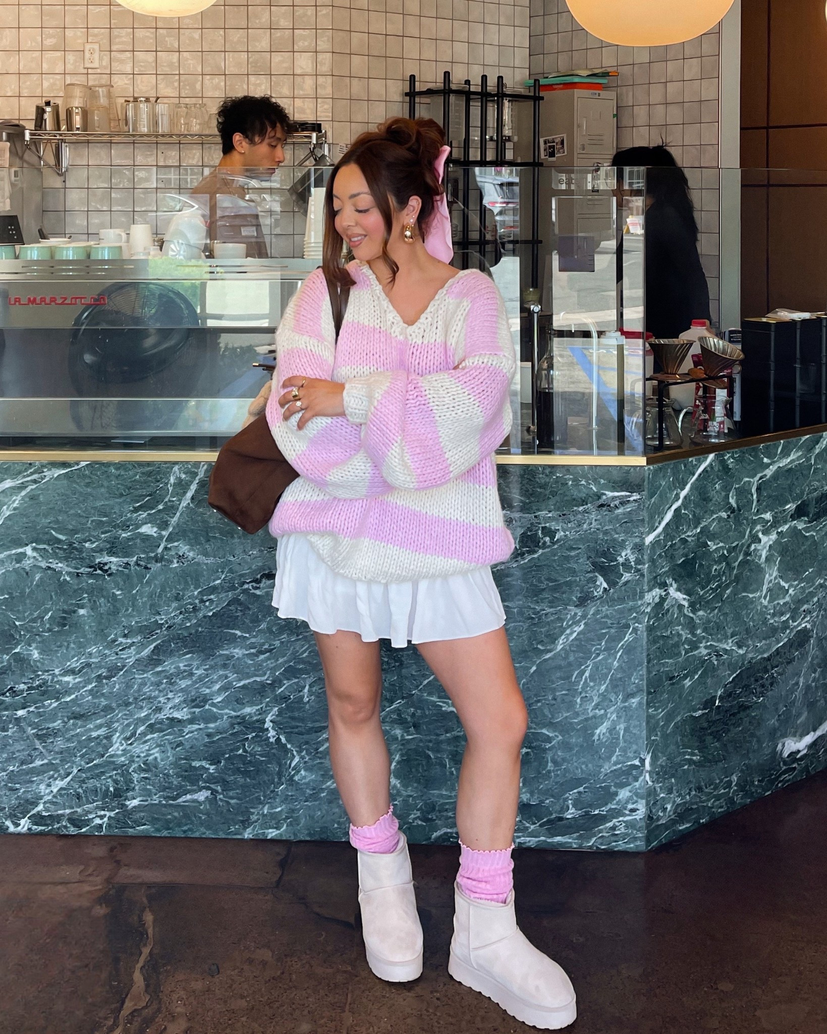 Pink and white chunky knitted sweater, ruffle mini skirt and Uggs outfit inspo 💖 

#LTKValentine #LTKootd #LTKSaleAlert