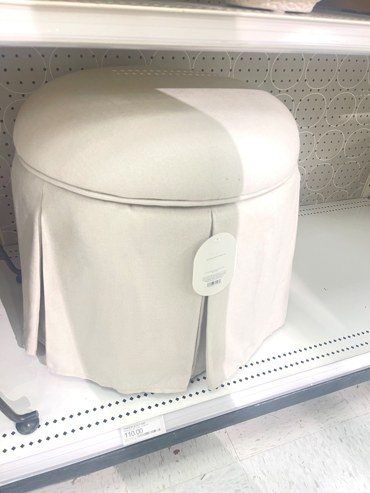 Pleated off white round ottoman. Use in small spaces or as an accent chair’s footrest 