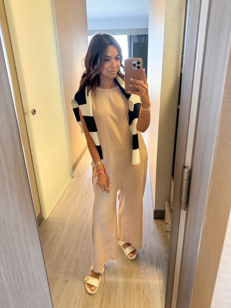 Wearing the size 0 in linen jumpsuit, this is so comfortable and breathable for summer! It also comes in a pretty navy which is now in my cart! Runs TTS. Sandals are LV but linked similar 

#LTKStyleTip #LTKOver40 #LTKSeasonal