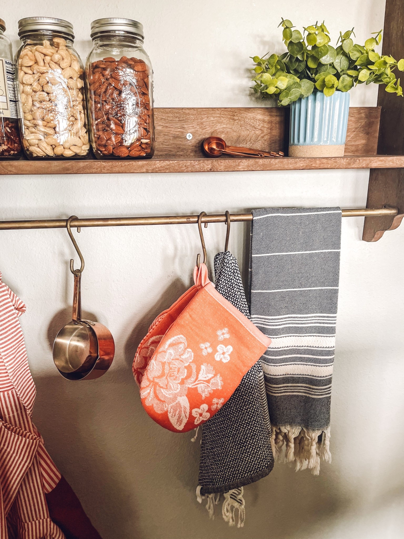 A little cozy kitchen styling with simple, functional finds 🤎 Glass pantry jars, copper measuring cups, striped tea towels, + a wood shelf create the perfect warm farmhouse kitchen look. The shelf is from Magnolia + I’m truly obsessed with it! My new Pioneer Woman oven mitts add the perfect pop of color for Spring! I love mixing practical kitchen storage with pretty textures for everyday decor. Perfect inspiration for Walmart kitchen finds, spring kitchen refresh, farmhouse decor, open shelf styling, pantry organization, + budget friendly home goods.

#LTKHome #LTKspring #LTKSeasonal