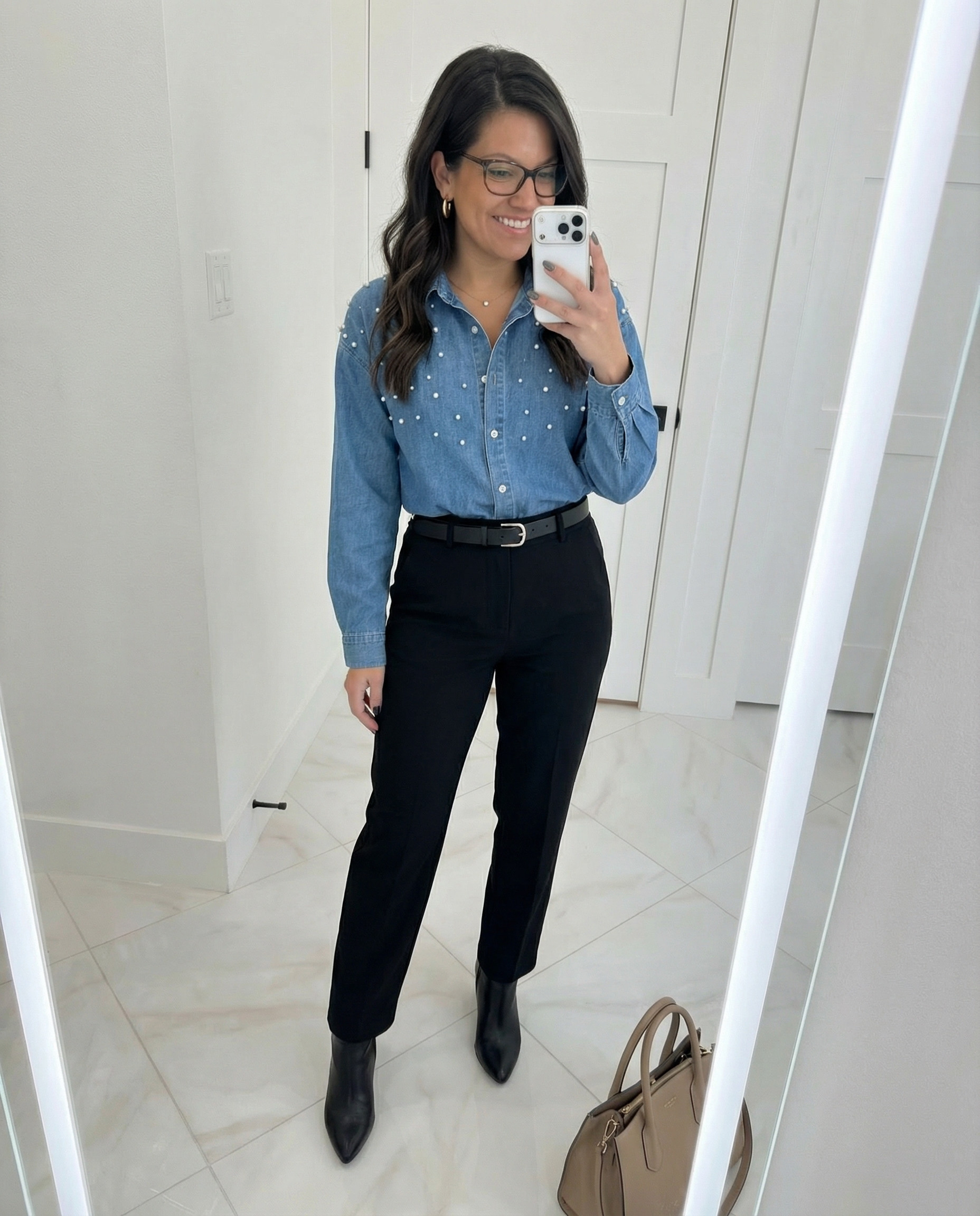 Polished everyday outfit with a chic twist 🤍 Styled a pearl-detail denim button-down shirt tucked into black tailored ankle pants for an effortless work-to-weekend look. Finished with pointed-toe black ankle boots, a structured neutral handbag, and minimal gold jewelry. Perfect for the office, date night, or elevated casual days. #LTKstyletip #LTKworkwear #LTKunder100 #LTKfashion
#denimshirt #pearlshirt #buttondownshirt
#blackpants #tailoredpants #workoutfit
#officeoutfit #businesscasual #chicstyle
#ankleboots #fallfashion #neutraloutfit
#everydayoutfit #classicstyle #womenownedbrands 

 #LTKootd #LTKPetite