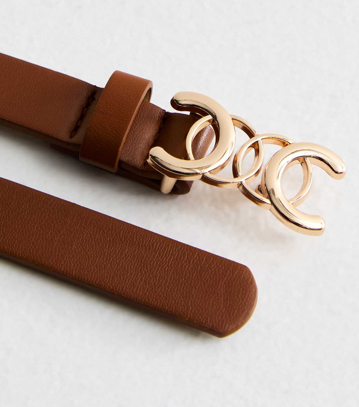 Tan Leather-Look Circle Buckle Skinny Belt
						
						Add to Saved Items
						Remove from Save... | New Look (UK)