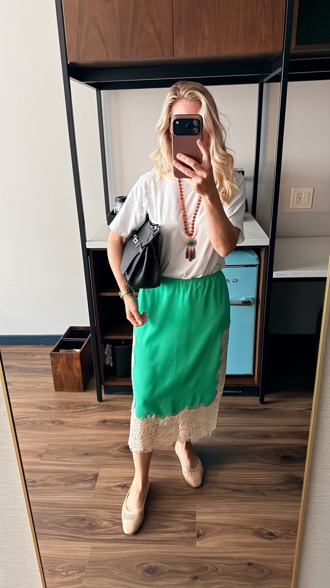 One skirt, endless possibilities. ✨

This is exactly why I pack pieces that can be styled multiple ways. A simple white tee keeps this look relaxed and effortless for a day of training, while the lace-trim slip skirt adds just enough polish to feel elevated.

Finished with woven flats, a statement necklace, and a structured black bag, it’s proof that comfortable doesn’t have to mean boring.

My favorite travel outfits are the ones that work hard in my suitcase and make getting dressed easy.

What makes this outfit work:
🤍 Basic tee
💚 Statement skirt
🖤 Structured bag
✨ A few accessories with personality

Simple formula. Big impact.

#TravelStyle #CapsuleWardrobe #VacationStyle #SlipSkirtOutfit #SummerStyle #EffortlessStyle #BusinessTravel #LTKStyle #MixAndMatchWardrobe #EverydayChic

#LTKootd #LTKWorkwear #LTKgrwm