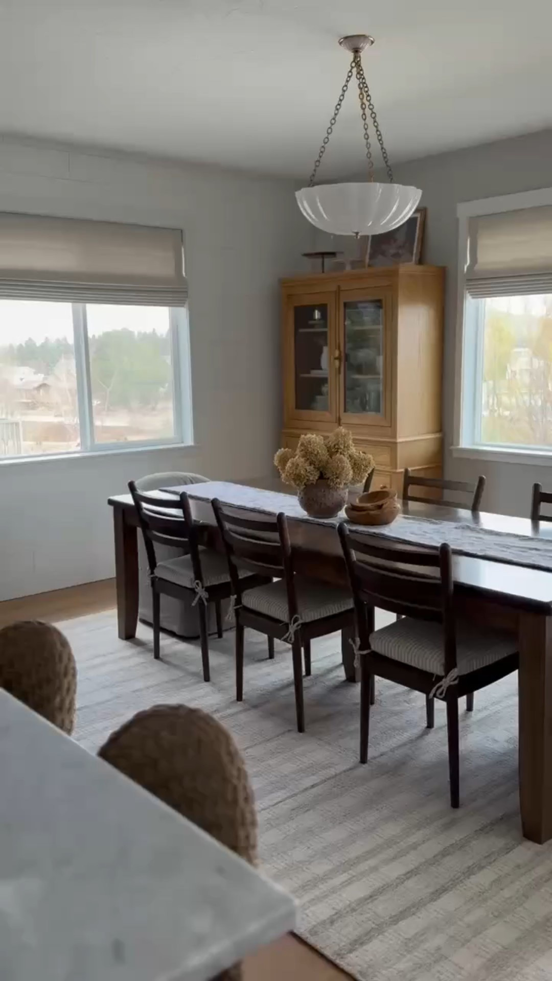 I love our dining space! Enough seats for the entire family, dark finishes juxtaposed with honey wood tones, and warm upholstery to soften all the edges. Our chandelier is also on sale—use code CINDY15! 

#LTKHome