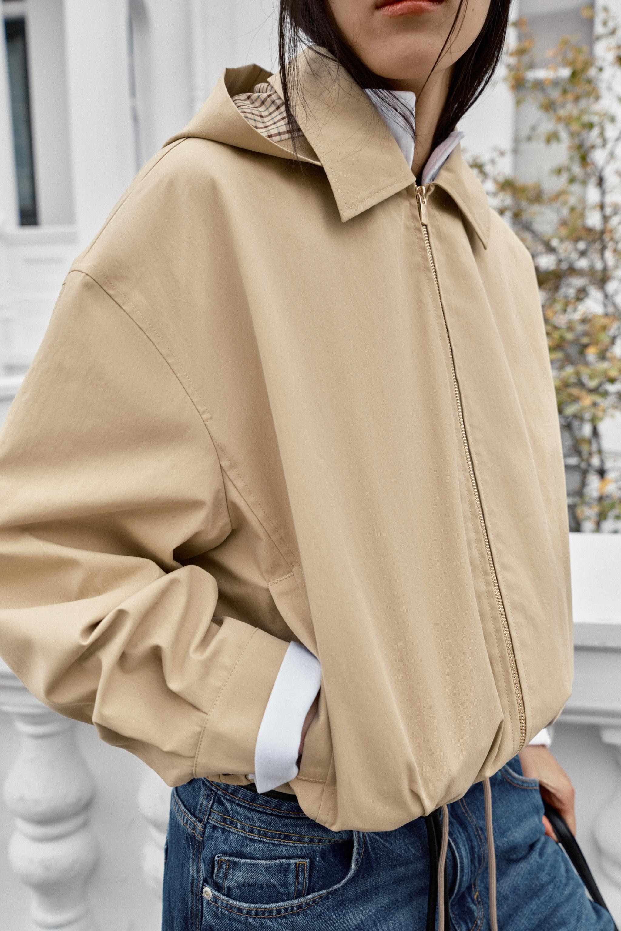Jacket with a lapel collar and detachable hood with button fastening. Long sleeves. Front welt po... | Zara US