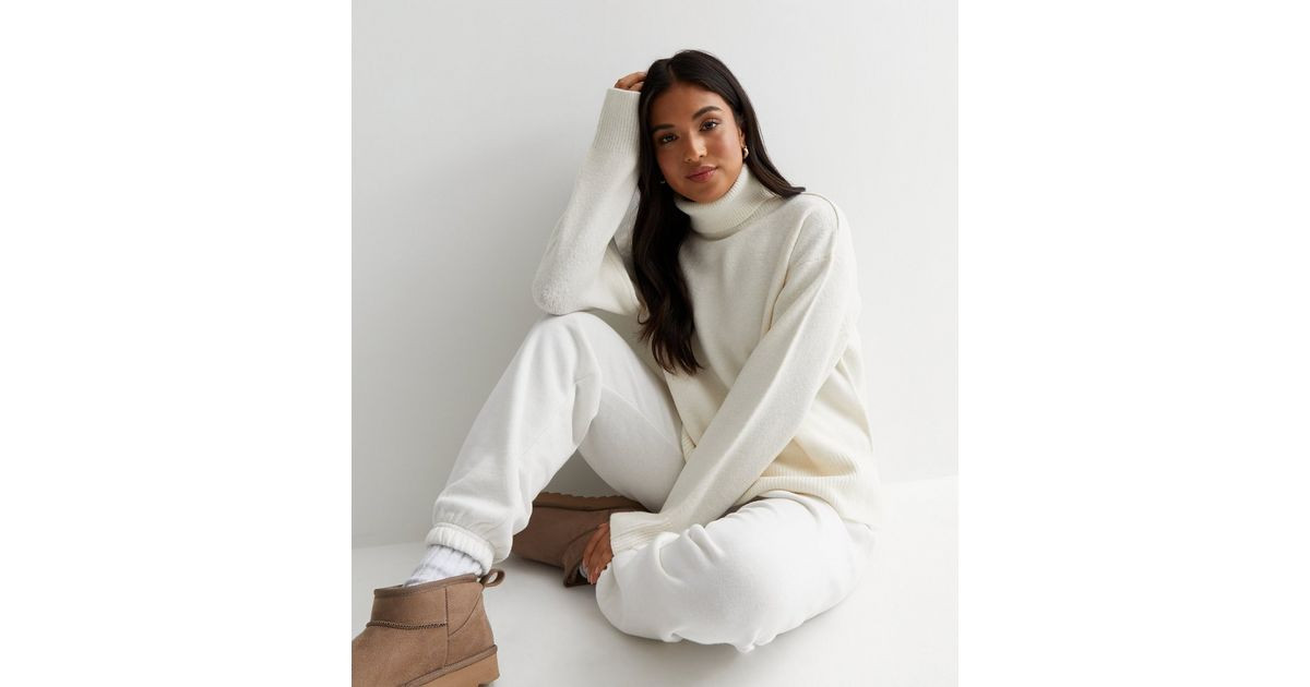 Petite Off White Knit Roll Neck Split Hem Jumper
						
						Add to Saved Items
						Remove fro... | New Look (UK)