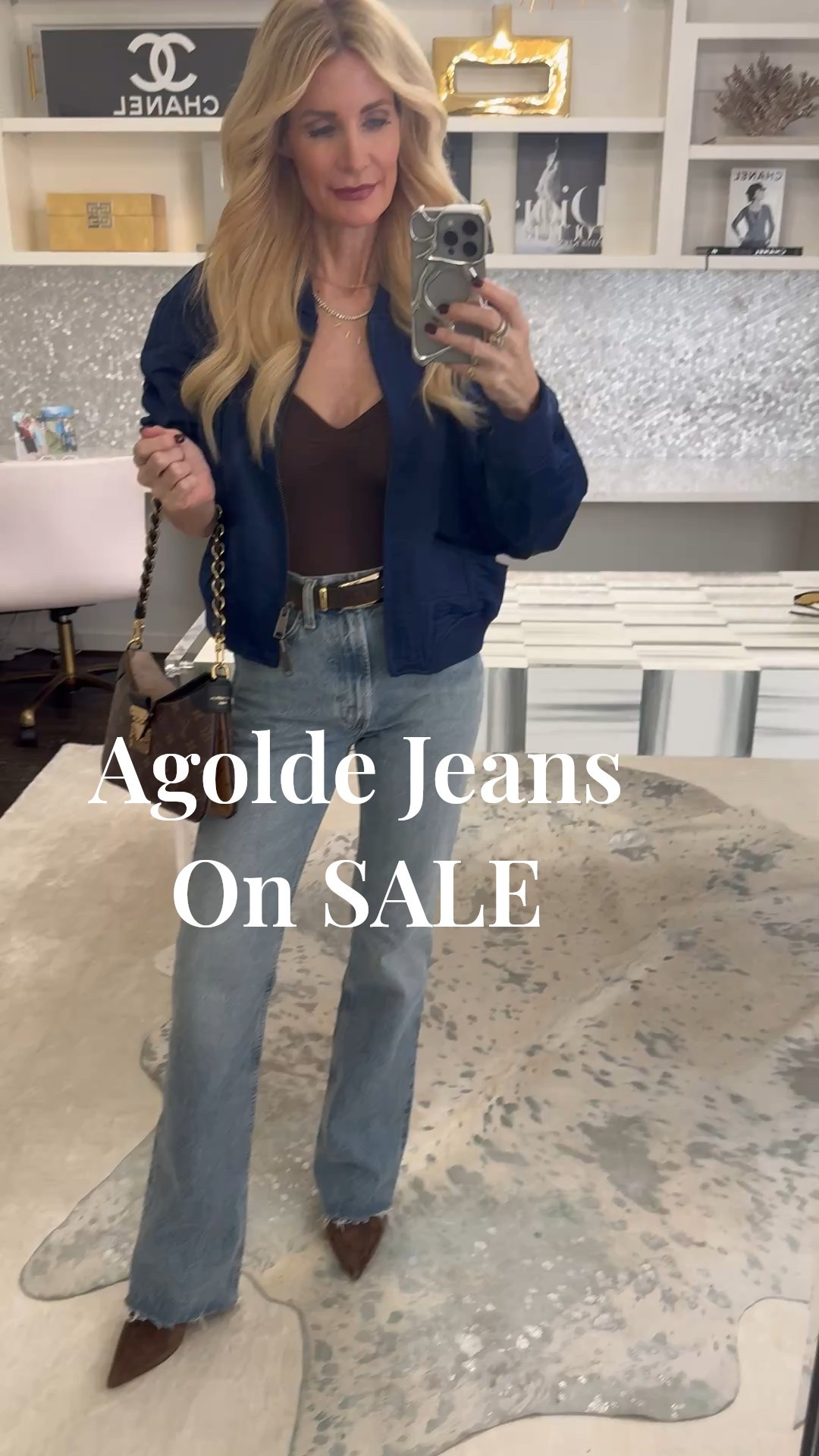 Sunday brunch outfit of the day ✨ These high-waisted Agolde flare jeans are on sale right now and I’m obsessed with the raw hem and light wash — they’re incredibly flattering and go with everything. I paired them with a super slimming Skims bodysuit for that cinched-in waist, then finished the look with a chic navy satin bomber for an elevated casual vibe.

I’m wearing a size 24 in the jeans and they fit true to size. 

 #LTKOver40 #LTKSaleAlert #LTKFindsUnder100