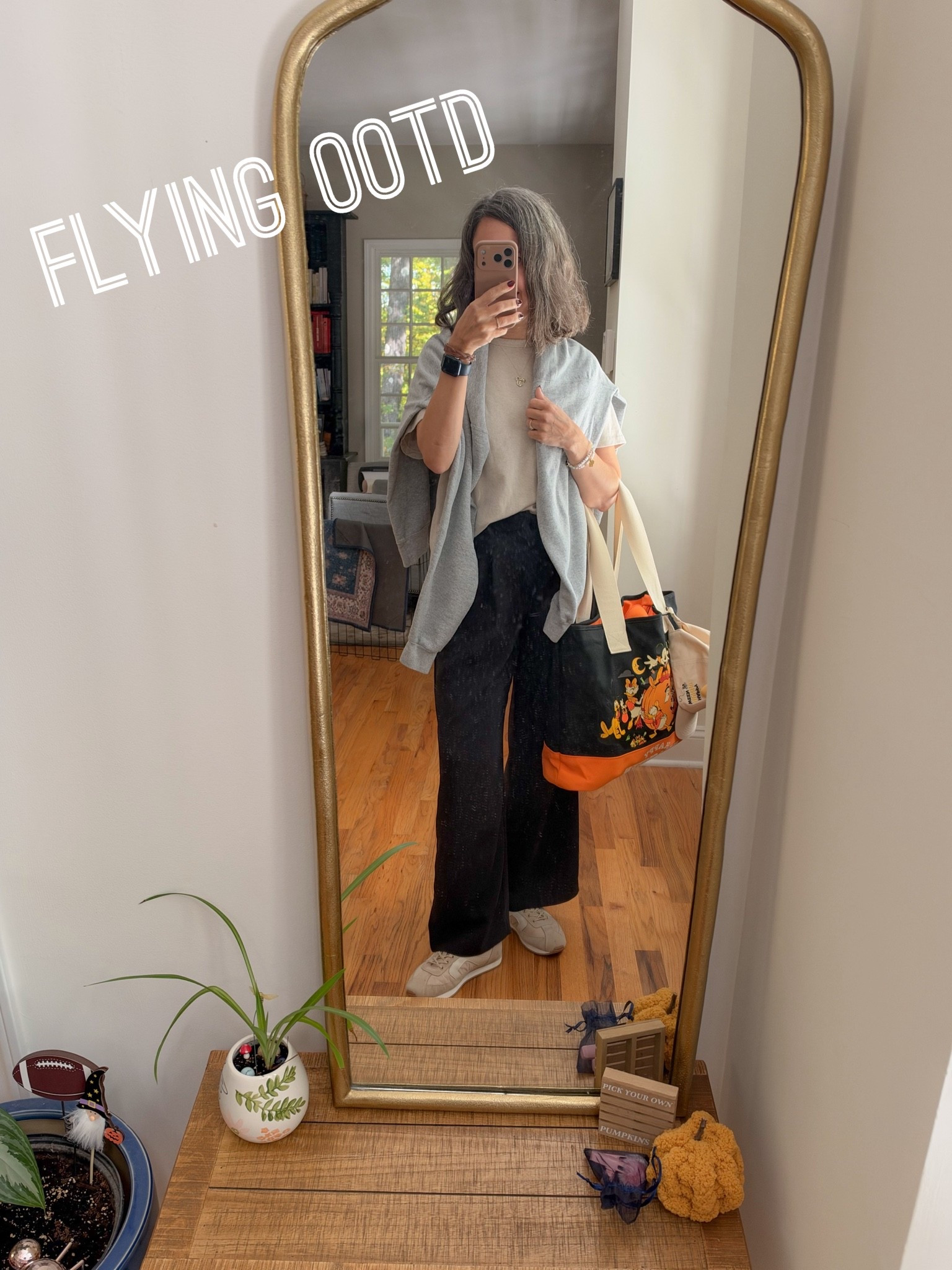 Flying today ! 
Target oversized tshirt, Gap wide leg pants, Blondo waterproof sneakers because it’s raining in FL! Disney Halloween tote bag. Vintage Mickey sweatshirt.