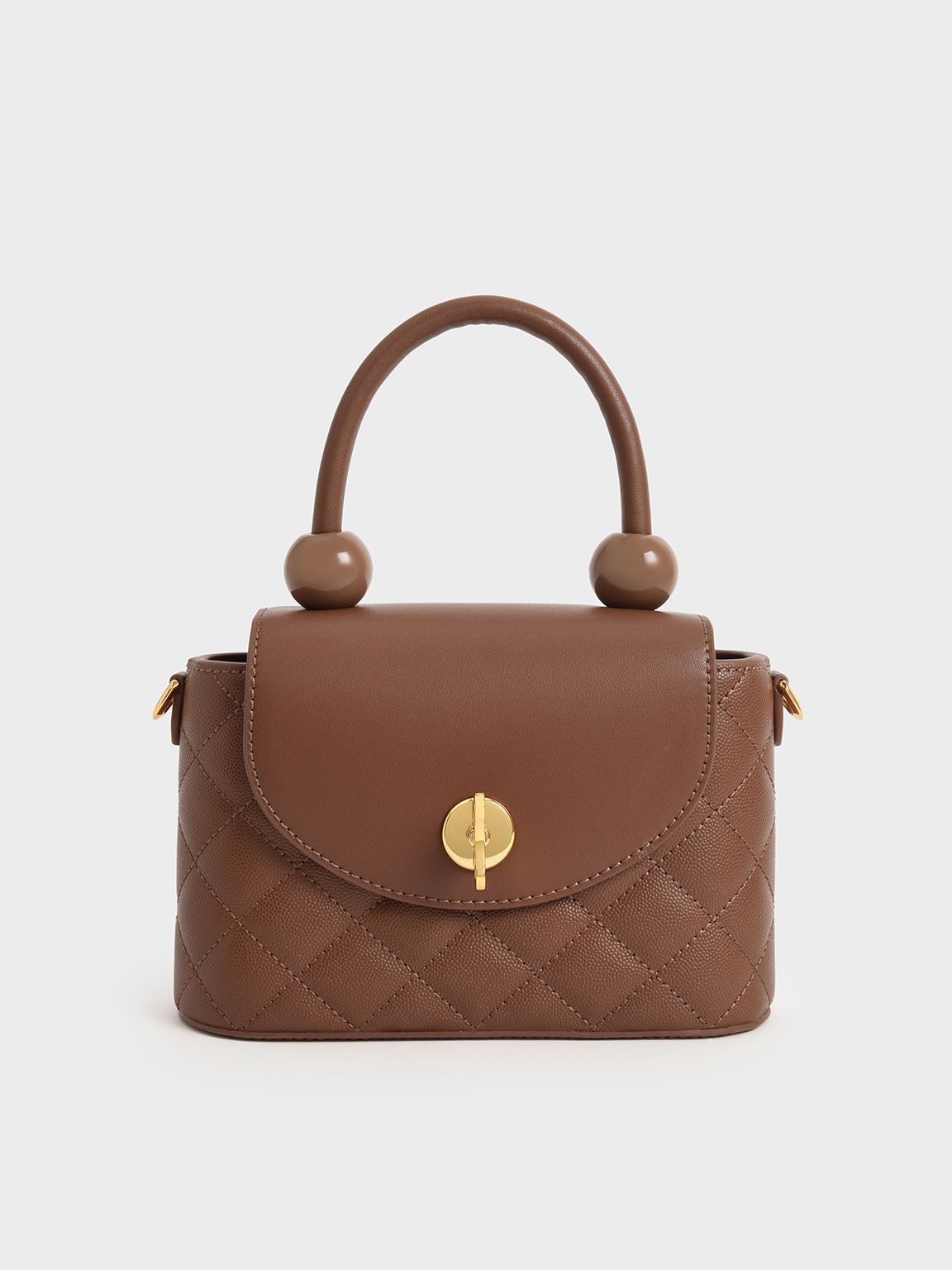 Round Quilted Top Handle Bag
 - Chocolate | Charles & Keith UK