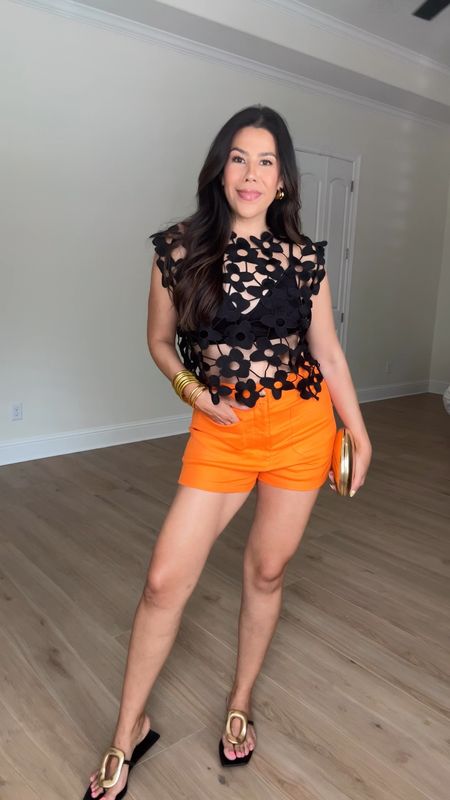 Another cute vacation outfit idea! I love these high waisted orange shorts, paired with this statement top! Wearing size 31 in shorts (sized up for length) and the top is one size.

#LTKVideo #LTKStyleTip #LTKSeasonal
