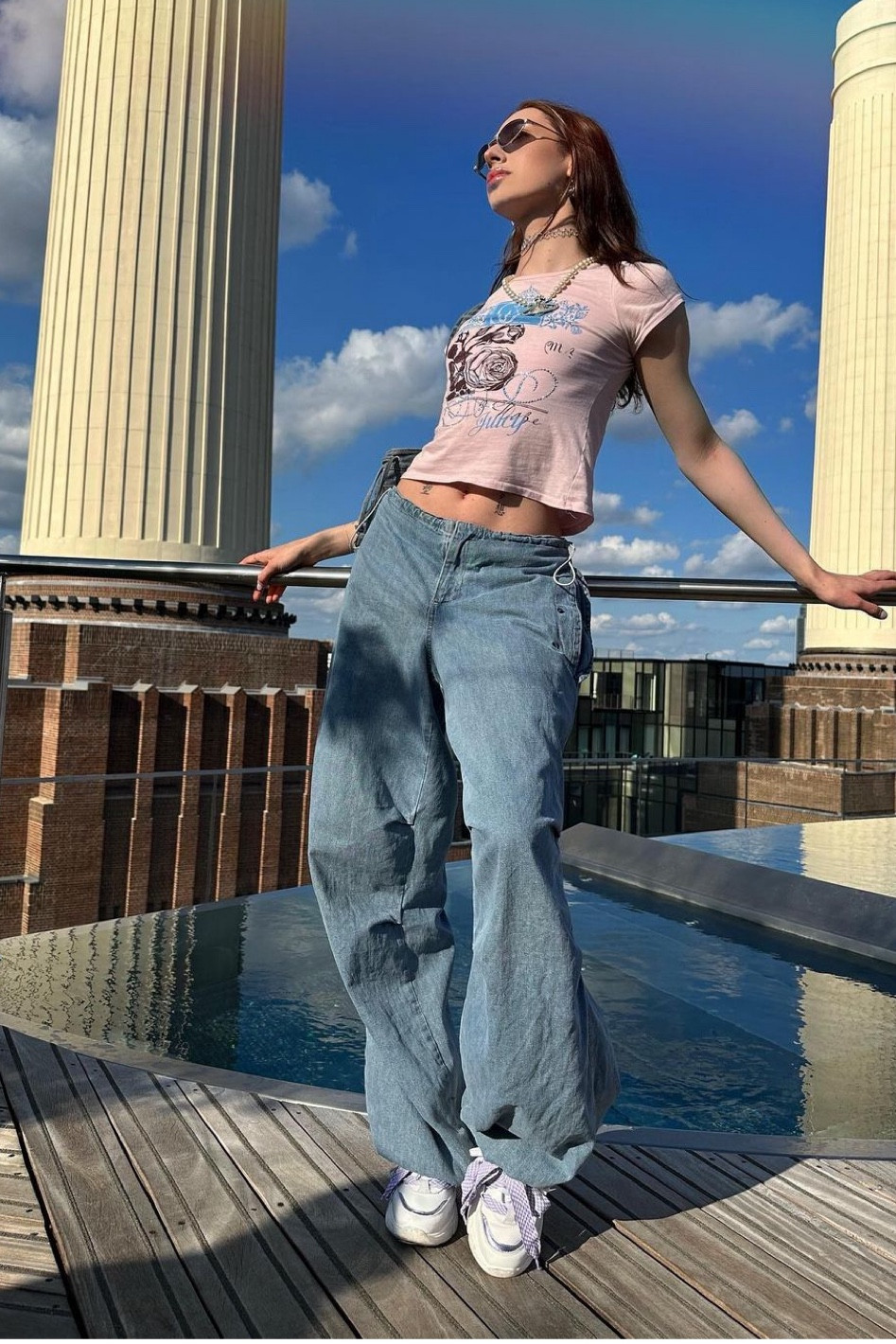 Pink graphic baby tee, denim parachute pants, baggy jeans, ed hardy t-shirt, white chunky trainers 

#LTKSeasonal #LTKeurope #LTKstyletip