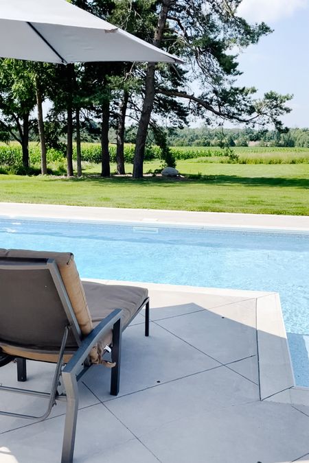 FARMHOUSE POOL TIME 
.
Neutral calm colours are perfect around our pool! 
.
Dark grey umbrella and beige lounger!! (This target lounger is no longer available but here is something similar)!

#LTKSeasonal #LTKhome #LTKstyletip