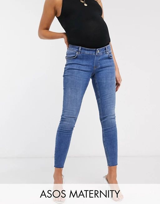 ASOS DESIGN Maternity Ridley high waisted skinny jeans in mid wash blue with over the bump band | ASOS AU