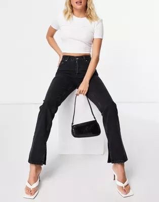 ASOS DESIGN organic cotton blend mid rise '90's' straight leg jeans in washed black with split he... | ASOS (Global)