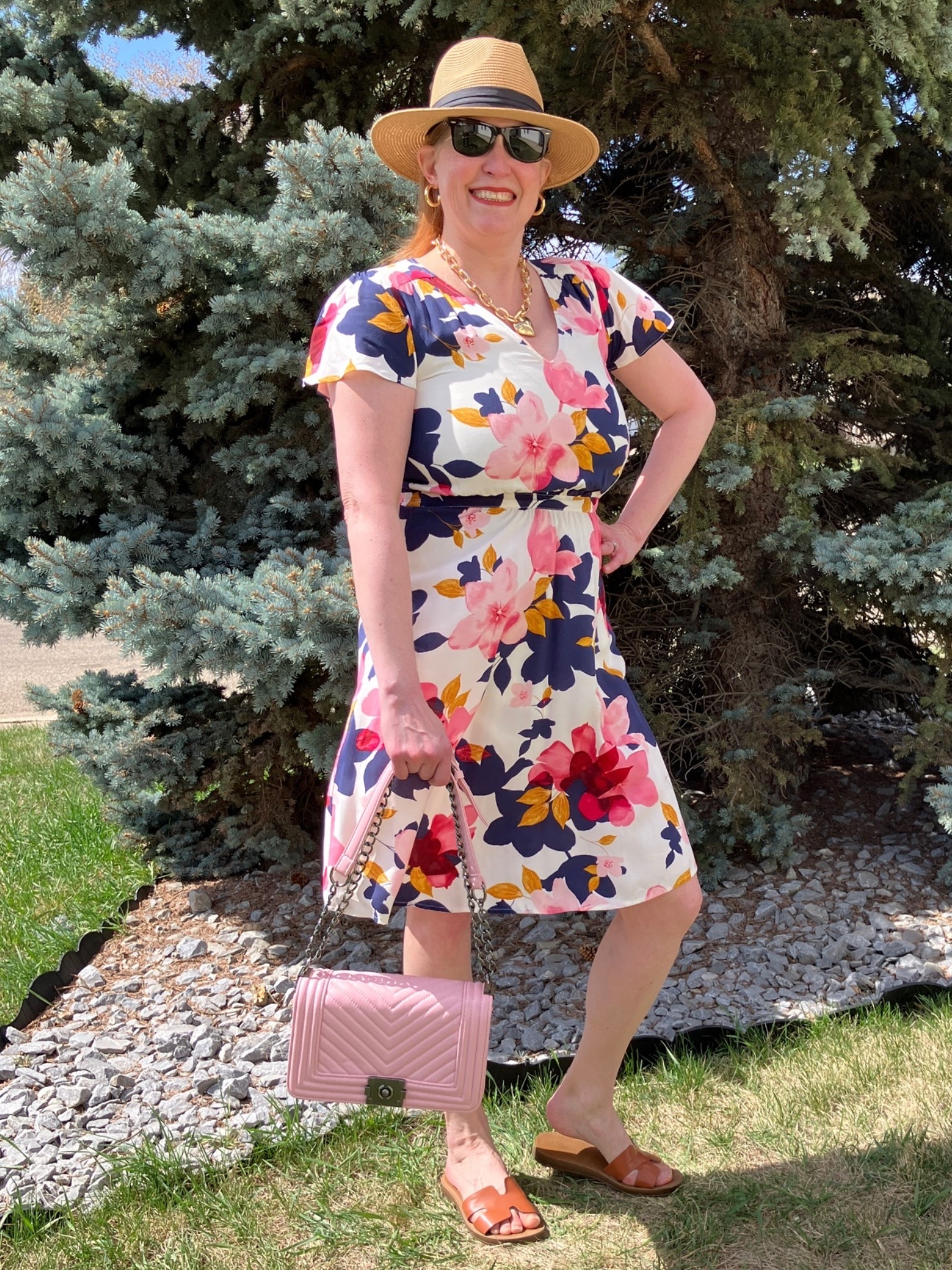 When you wear a dress your guy will say, “She’s a beauty!” My husband doesn’t always agree with what I wear. Actually more often than not! But this outfit was a winner when I put it on to shoot. You see, my husband is my photographer so he gets to see my looks up close and personal. I had to put on a hat for this look and grab my fav pink bag. Even though I have pink shoes I decided to wear neutral sandals to give a nod to the colour of my hat. I’m ready for brunch or church or even a fancy picnic. Canadians click on the first links to shop, and Americans click on the second links to shop. If there’s only one link then you can shop it in your own country. And remember, trendy doesn’t have to be expensive! Bye!

#LTKdresses #LTKsummer #LTKover50style
