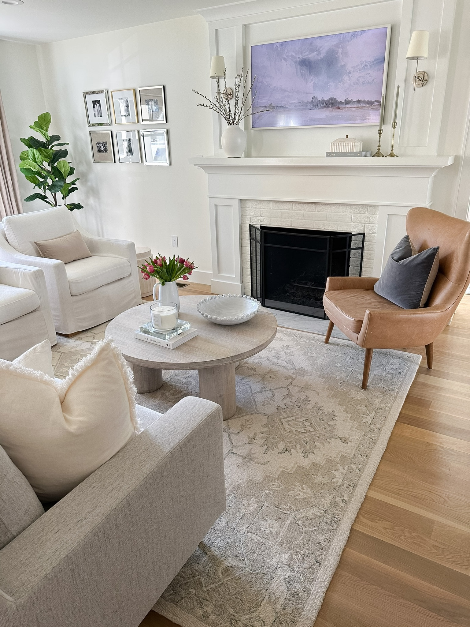 Cream, ivory, beige rug, neutral living room design, living room furniture, white slipcovered accent chairs, frame tv, home decor, coffee table decor 

#LTKhome #LTKstyletip #LTKunder100