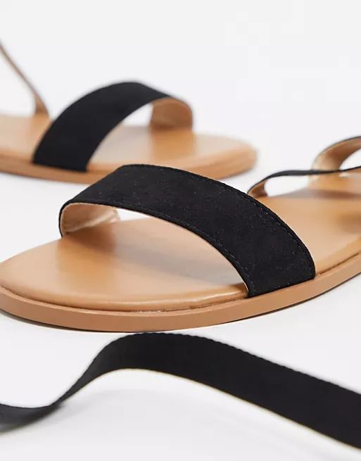ASOS DESIGN Finland tie leg flat sandals in black | ASOS (Global)