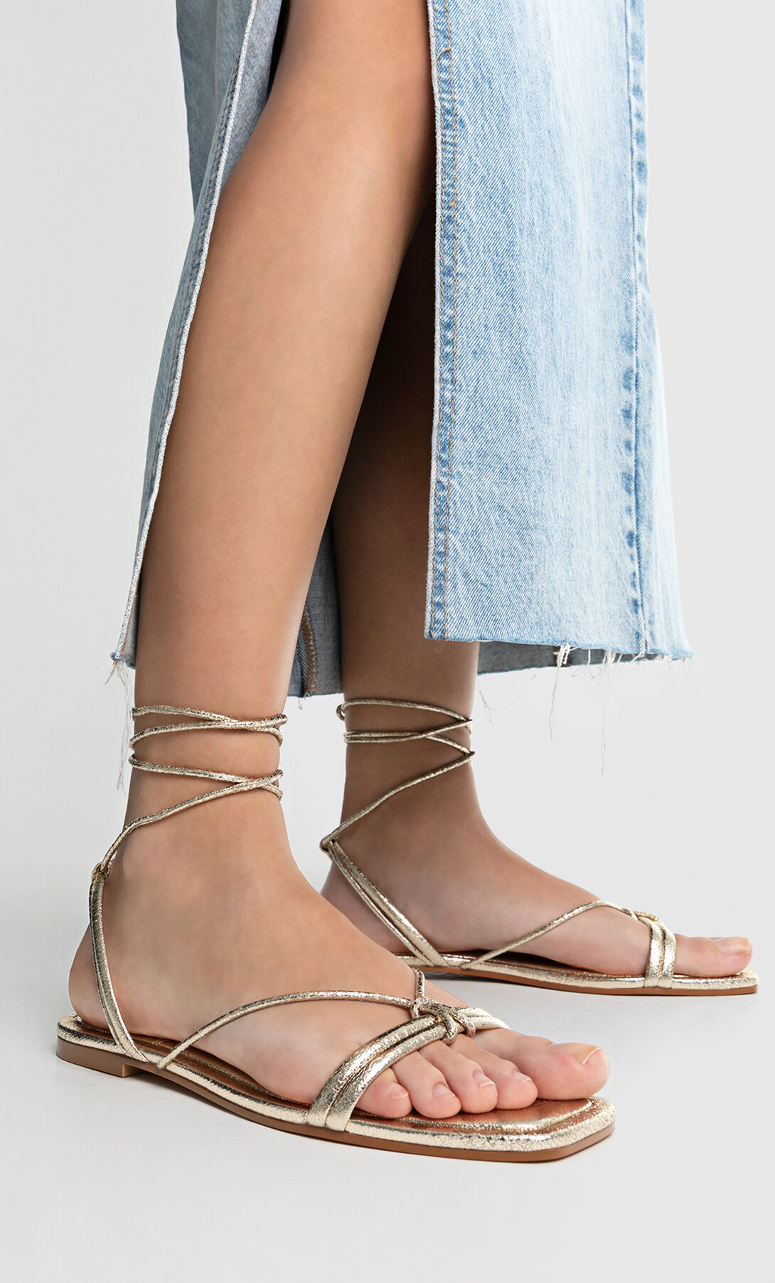 Flat gold strappy sandals - Women's fashion | Stradivarius United Kingdom | Stradivarius (UK)
