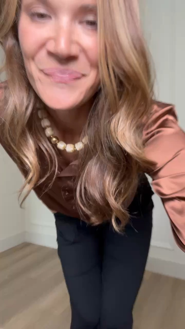 This rich brown button down is such an easy way to make black pants feel more interesting. The silky fabric drapes beautifully, and the long sleeves make it a great option for the office, dinner, or an upcoming event.

Size L

Tall girl outfits, Brown satin blouse, Button down shirt, Black pants outfit, Tall friendly clothing, Office outfit ideas, Dinner outfit, Dressy casual style, Neutral outfit, Fall transition outfit, 6 foot style, Stang and Co

#LTKTall #LTKWorkwear #LTKSeasonal