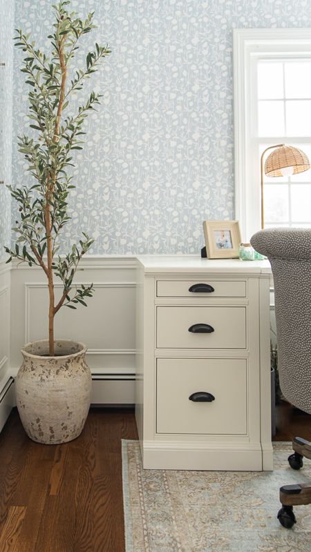 Functional home office with Serena and Lily patterned wallpaper, white desk, office chair, artificial olive tree, and more coastal style home decor

#LTKhome #LTKfamily
