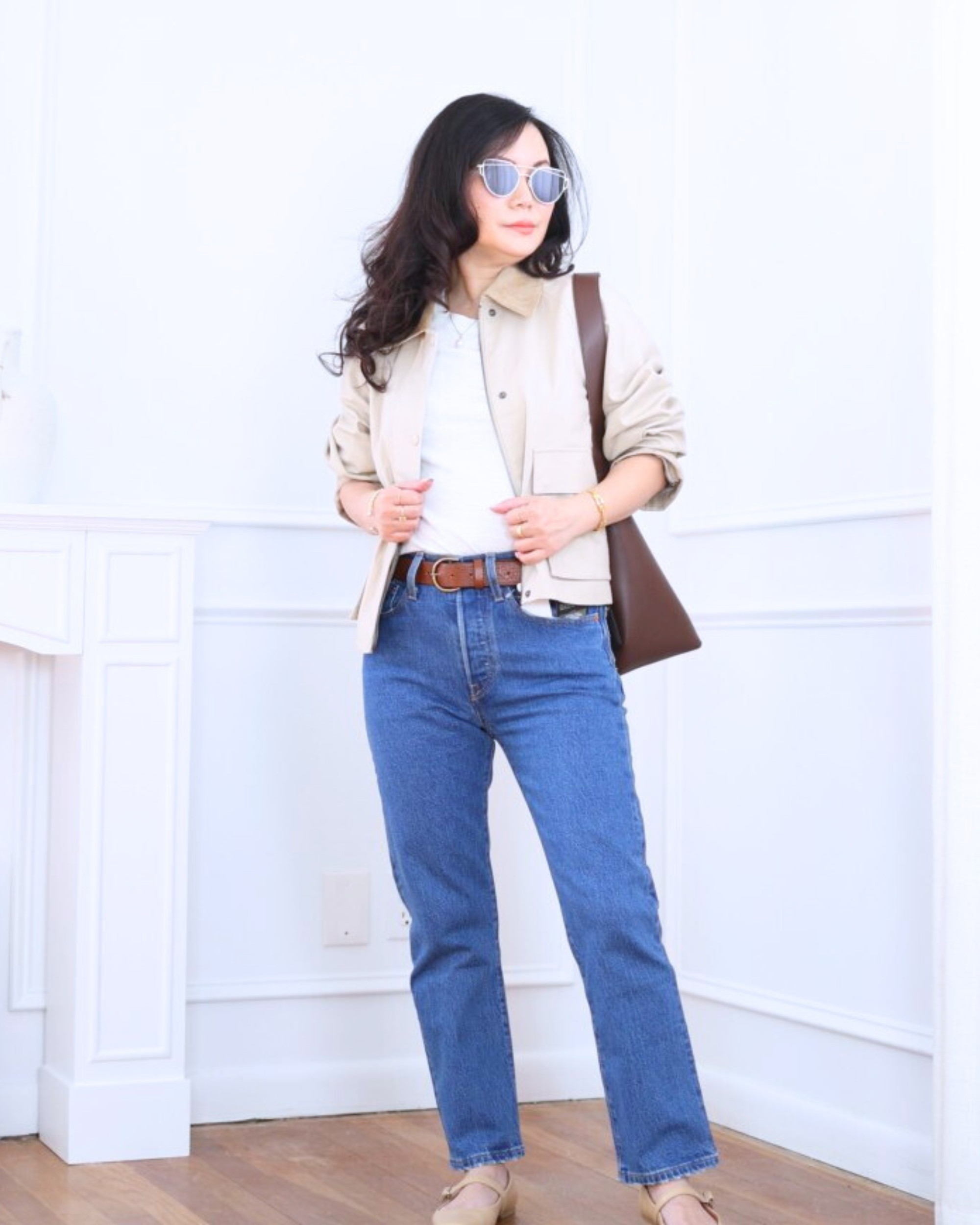 Barn jacket from Uniqlo layered over a white tee, paired with Levi’s jeans and Mary Jane flats — classic, easy, and effortlessly put together for everyday wear. I’m 5’2, wearing size XS.

#LTKPetite #LTKOver40 #LTKootd