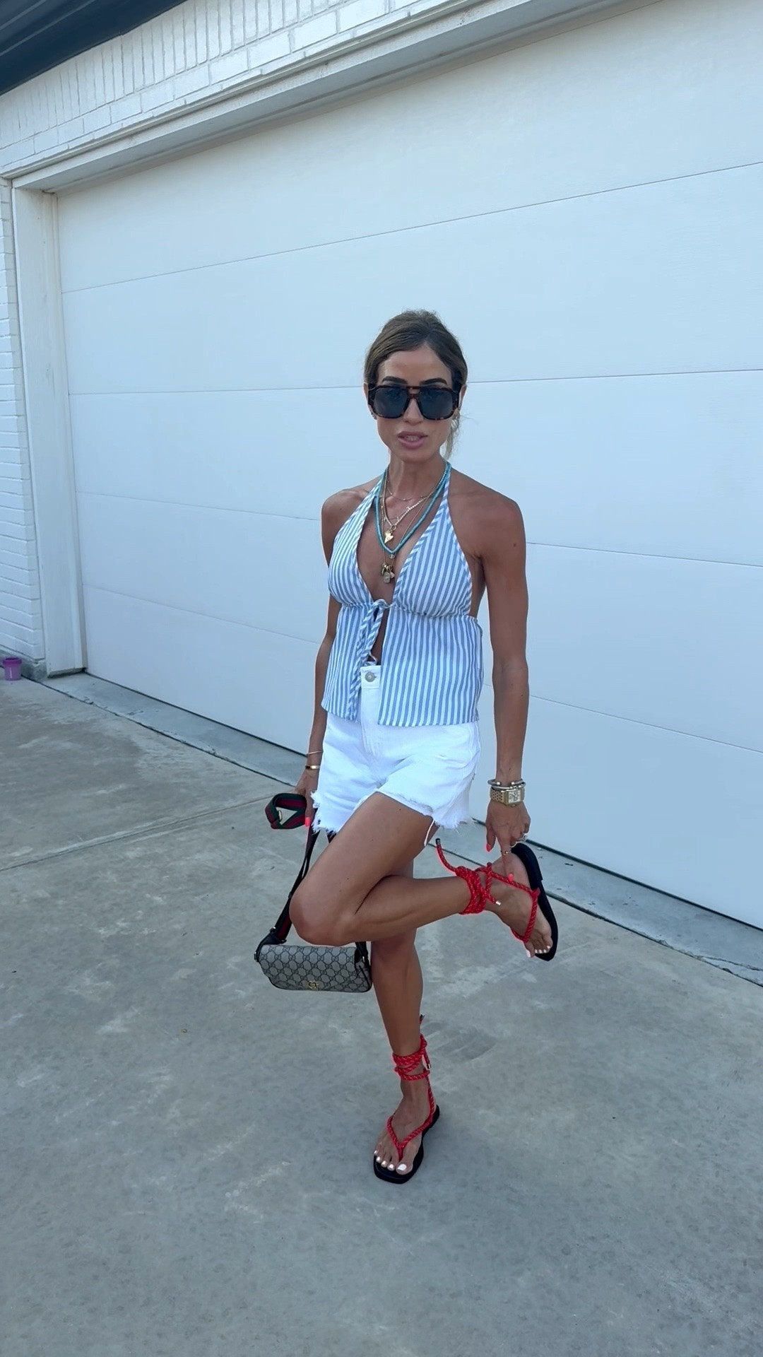 Yesterdays summer casual outfit of the day wearing this striped halter top in smallest size with white denim shorts and trending red rope sandals

#LTKPetite #LTKSaleAlert #LTKootd