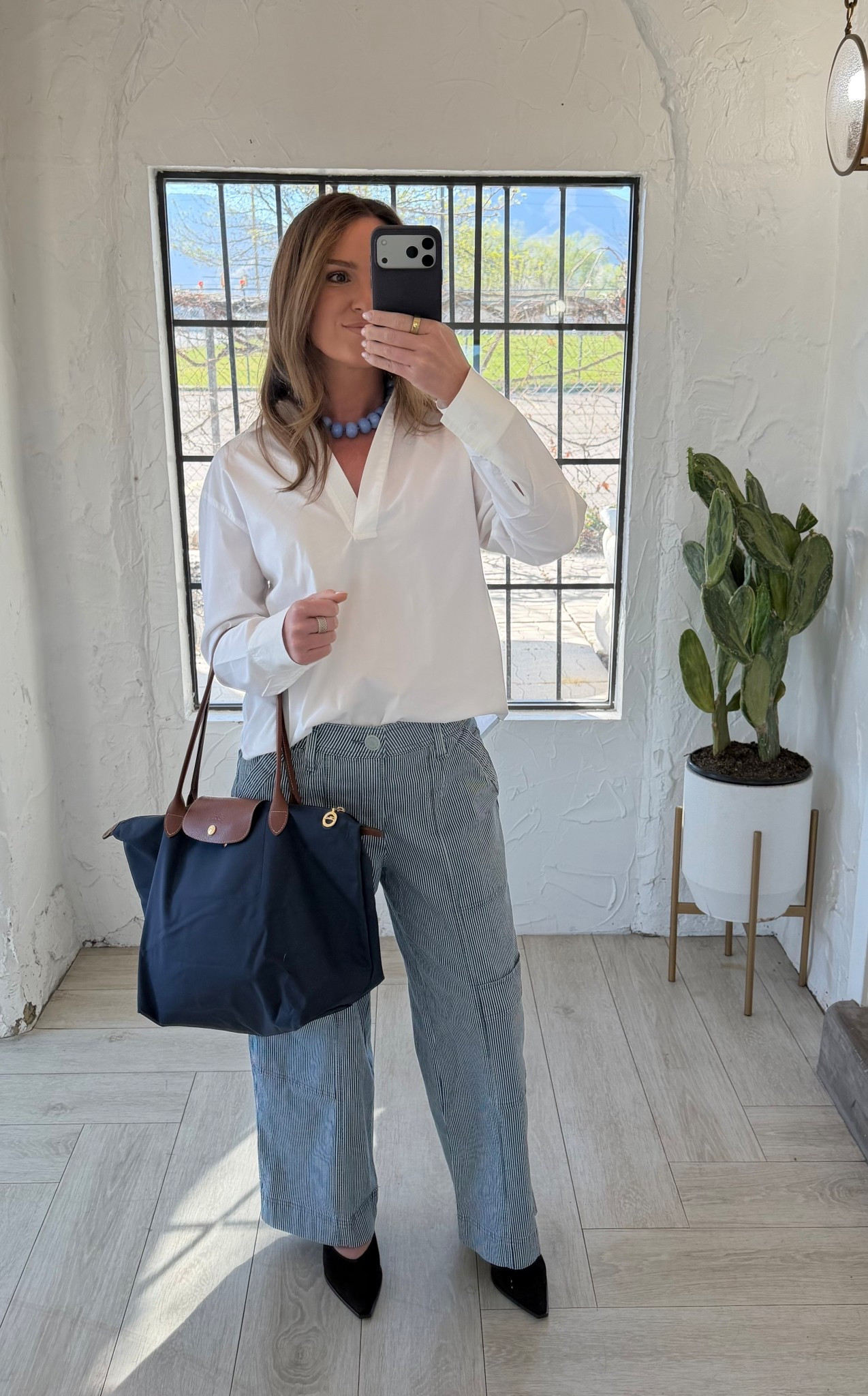 Lightweight spring/summer outfit that works for both the office and everyday wear. Styled Wit & Wisdom blue and white striped wide leg utility pants with a white collared pullover top, Steve Madden Shay pointed toe slingbacks in brown suede, a chunky BaubleBar necklace, and my navy Longchamp tote. Easy, comfortable pieces that still feel put together.

#LTKStyle #LTKFinds #OOTD #SpringOutfit #SummerWorkwear #WideLegPants #BusinessCasual #OfficeStyle #Longchamp #Baublebar #SteveMadden #EverydayStyle #WorkOutfit #OutfitInspo #BlueandWhiteStripes #EverydayWear #NordstromFinds #Nordstrom #ChunkyJewelry #StatementNecklace #Navy #SpringTrends #SummerWorkOutfit

#LTKootd #LTKPetite #LTKWorkwear