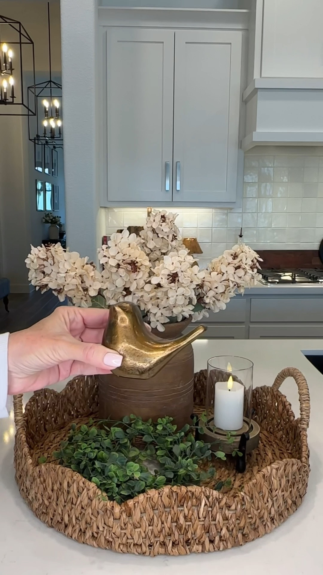 Tray styling 
Faux flowers
Faux hydrangeas 
Hurricane 
Flameless candles 
Brass bird 

#LTKHome