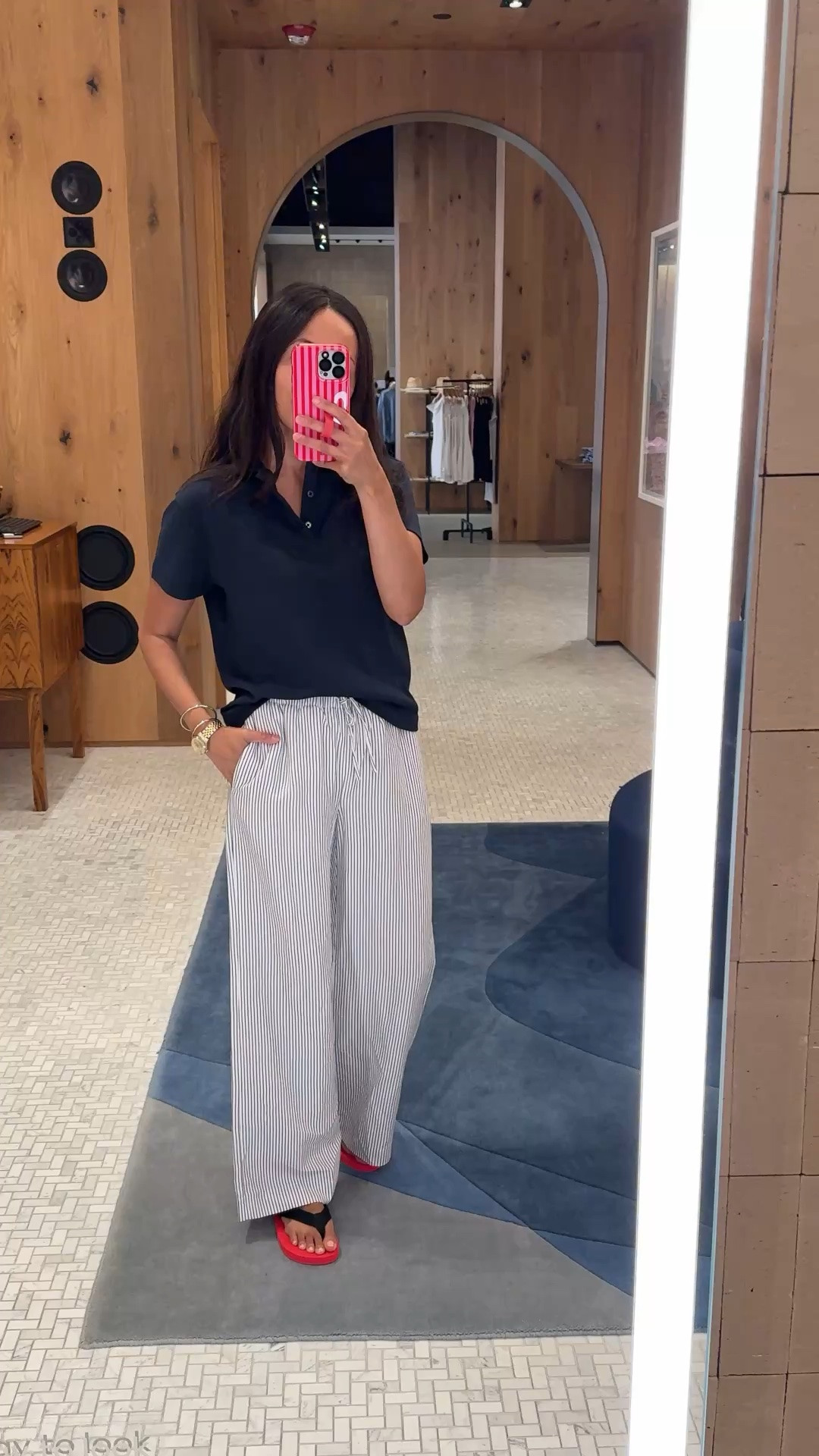 Summer pants outfit. Preppy chic. 
Polo shirt is a nice all cotton top. Double knit fabric is very soft and has structure to it. True to size. Navy color is chic. 
Striped wide leg linen blend pants look so cute!  True to size. Nice material with good drape. Flattering fit and stylish cut. 
Red flip flops.

#LTKOver40 #LTKootd