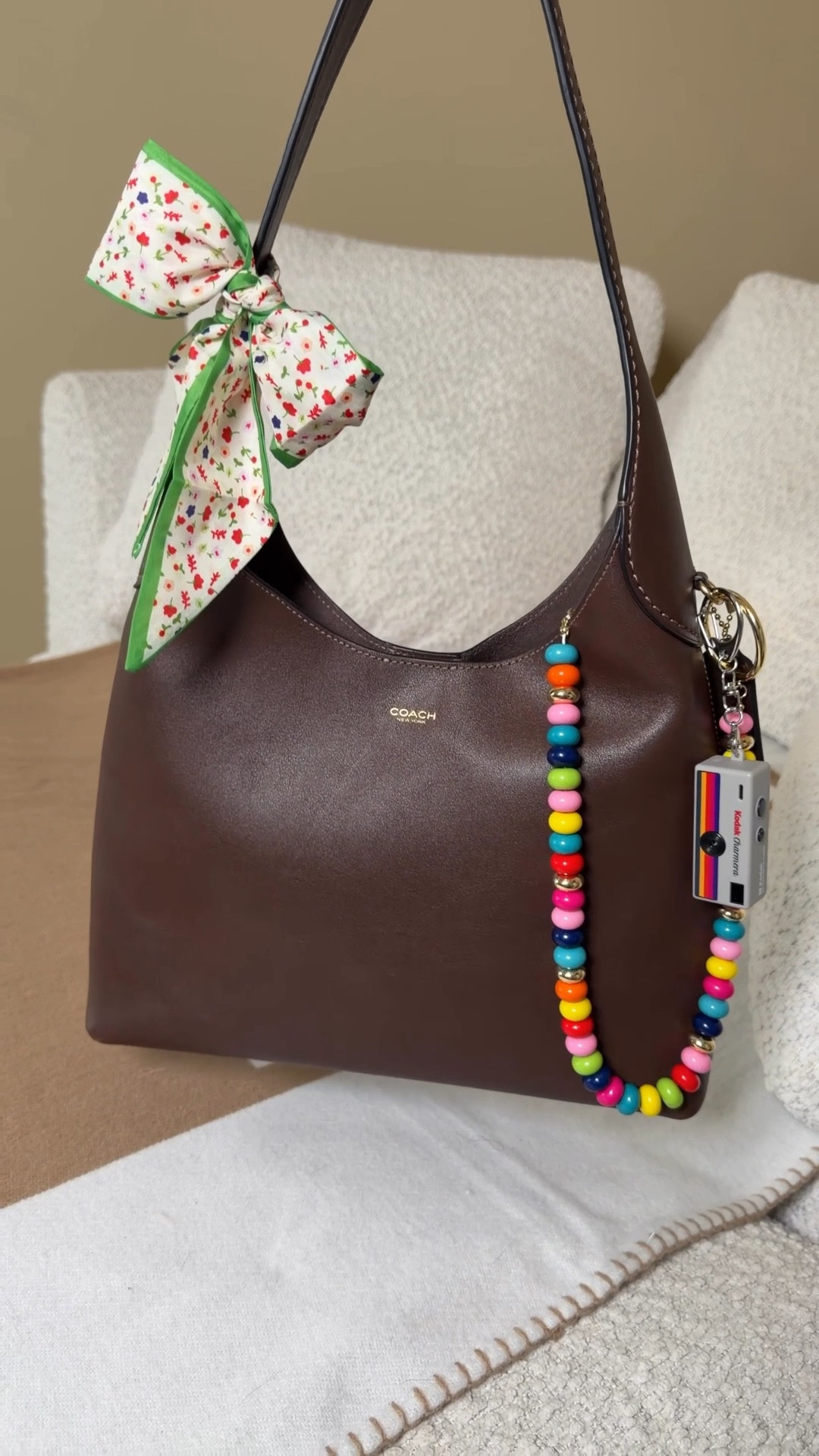 Getting my Coach Brooklyn 28 spring ready 🌸 
Strawberry lip peptide gloss
Orange blossom by Jo Mallon (I read that Kate Middleton wears this so I had to get it)
Some colorful springy accessories 
Colorful beaded chain by Baublebar
Charmera miniature digital camera bag charm 
Coach Brooklyn 28 coach bag coach bags bags for spring 


#LTKgrwm #LTKootd #LTKdayinmylife