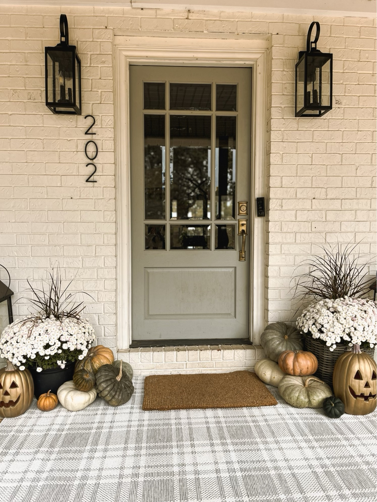 Indoor/outdoor area rug from Walmart! 

 loving how these pumpkins from Lowe’s turned out! I spray painted them gold to give them new modern look! 

#LTKhome #LTKSeasonal #LTKHalloween