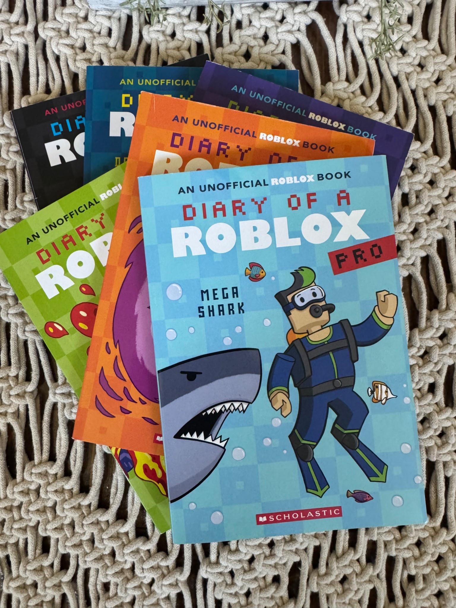 Do you have a Roblox fan in your house?! We bought this series for my boys, and they are obsessed! Both kids are Roblox fans, and they love these books! They come in a pack of SIX books, and Weston has read them ALL! He flew through them, and he gave them 5 stars! Brantley just started to read them too! #roblox #robloxbooks #dairyofaroblox #chapterbooksforkids #robloxbookseries #boysgifts #booksforboys 