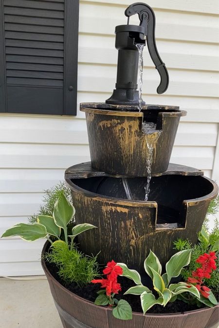 Gorgeous two tiered outdoor fountain turned into 3 tier with wine barrel planter. 
Wine barrel planter, rustic bronze  outdoor fountain, from Amazon, also linking some from Walmart 
