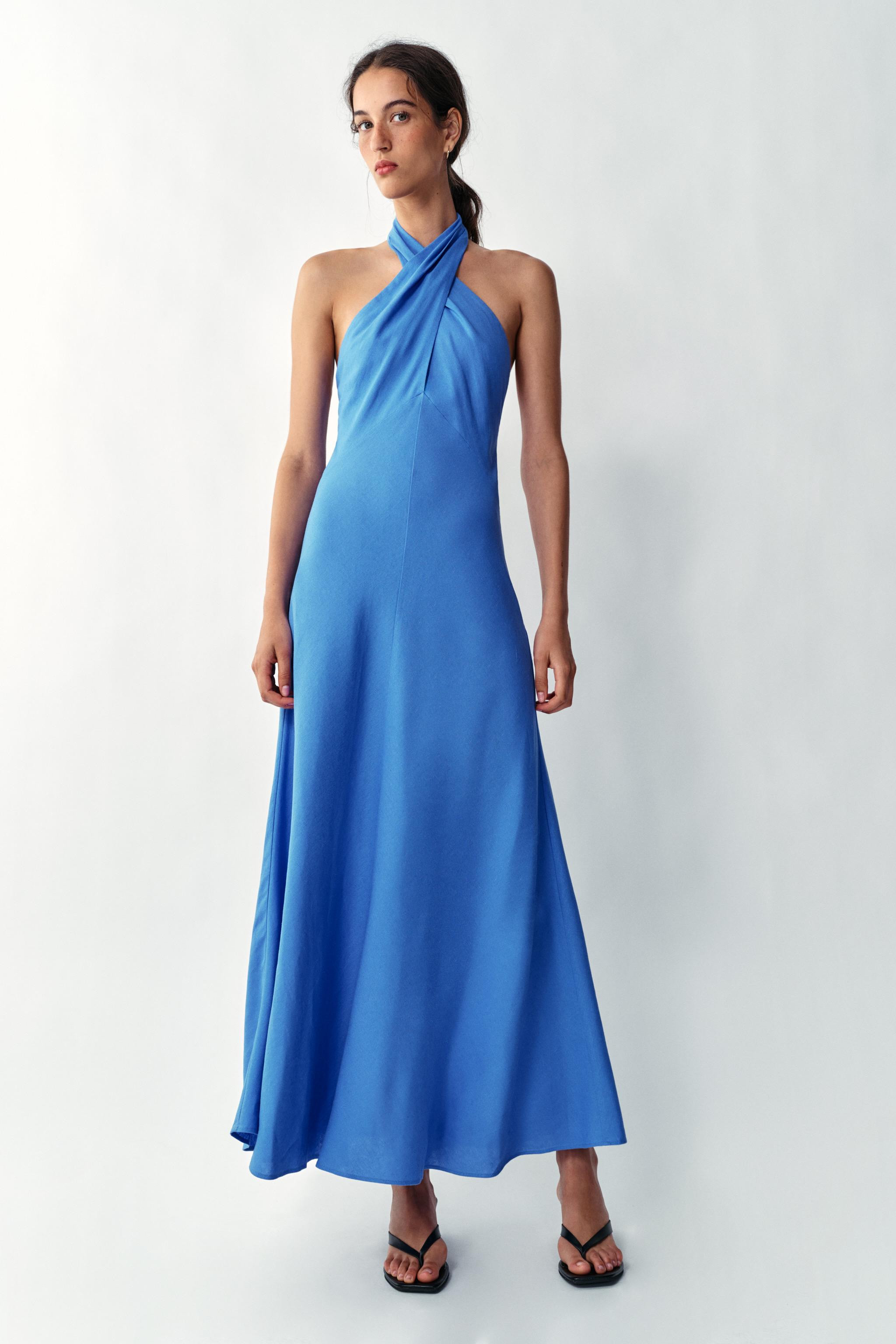 Midi dress made with linen. Crossed halter neckline and open back. Back hidden button closure. | Zara US