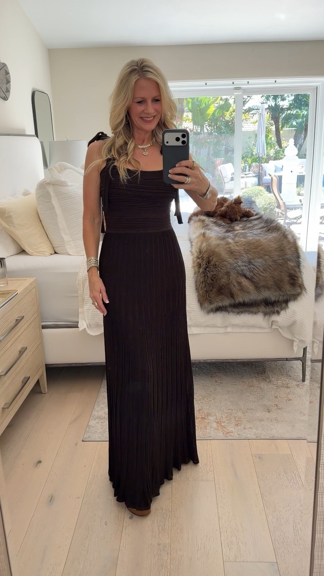 Life is a red carpet!  Celebrating in this beautiful Zimmermann metallic knit maxi with tie shoulders. A timeless investment piece that makes any occasion feel special. Wearing size 1 (could size down for a fitted look.  Runs long.  I’m 5’5” and wearing platform heel sandals) Linking budget friendly options. 

#LTKWedding #LTKOver40 #LTKFestival