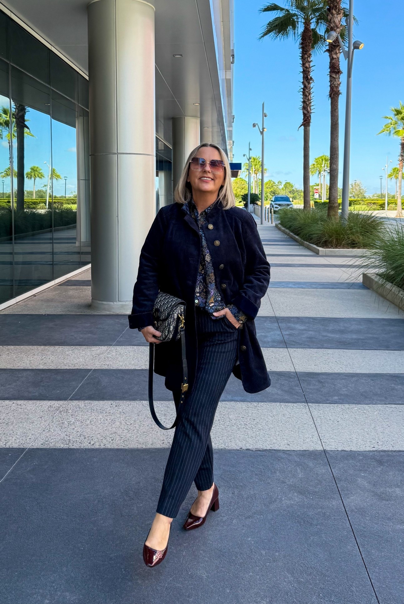 A classic navy fall look, corduroy coat, pinstriped pants, flower print blouse with burgundy shoes.



#LTKShoeCrush #LTKOver40 #LTKStyleTip