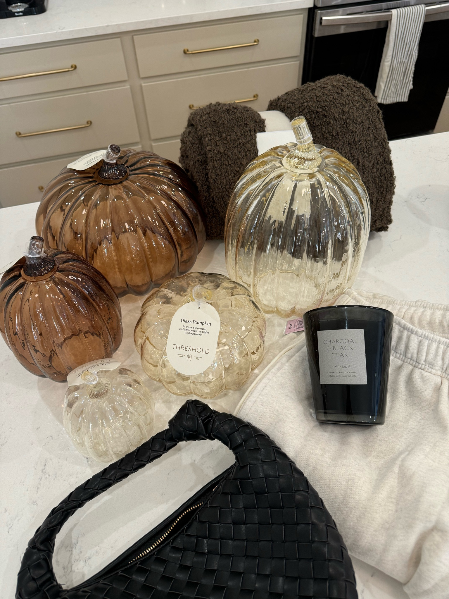I pretty much bought every size and color wave of these glass pumpkins! Im styling my mantel and coffee table with these, along with my favorite affordable fall candle everrr. I love that these go with my house style, organic/luxe/neutral. So cute for fall/halloween/thanksgiving and party decor!