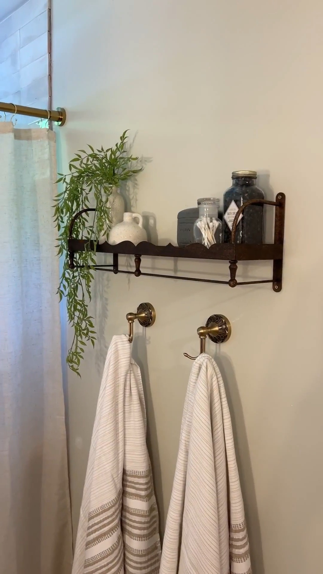 Bathroom details! Shower curtain, bathroom shelf, bathroom towel hooks ￼

#LTKHome #LTKOver40 #LTKvlog