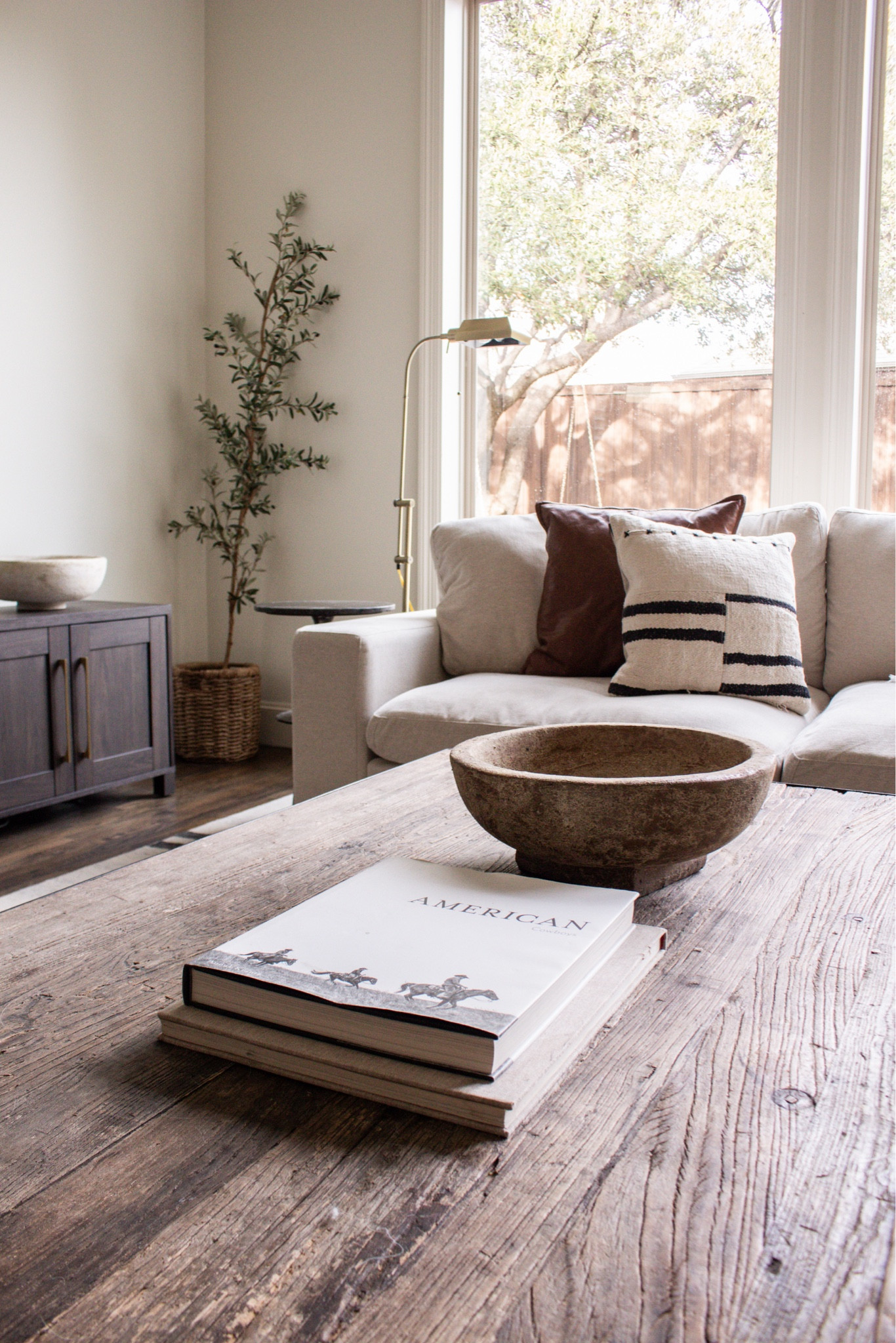 Modern organic living room with neutral sofa, wood beams, leather accent chairs, large area rug, and statement chandelier. Warm minimalist home decor, cozy luxury living room ideas.

#LTKSeasonal #LTKHome