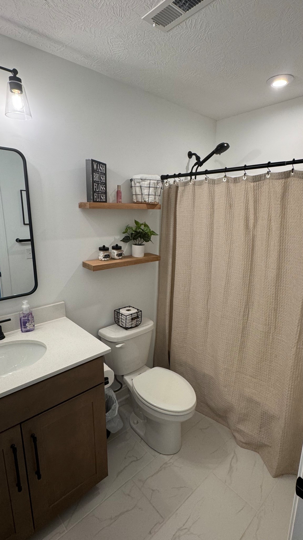 Sharing one of our upstairs full baths with you! Love how warm this space feels. 

#LTKFindsUnder50 #LTKHome