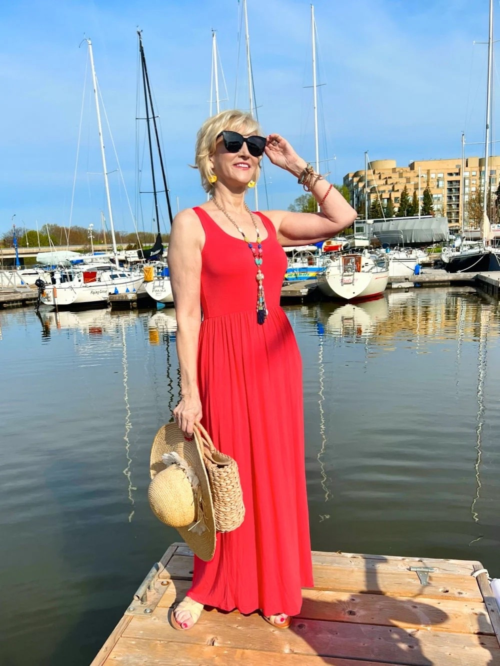 This sleeveless red maxi dress is such a beautiful statement piece while still feeling effortless and easy to wear. I love the flowy silhouette and how a simple dress like this can take you from a summer lunch to an evening out with just a few accessories.
